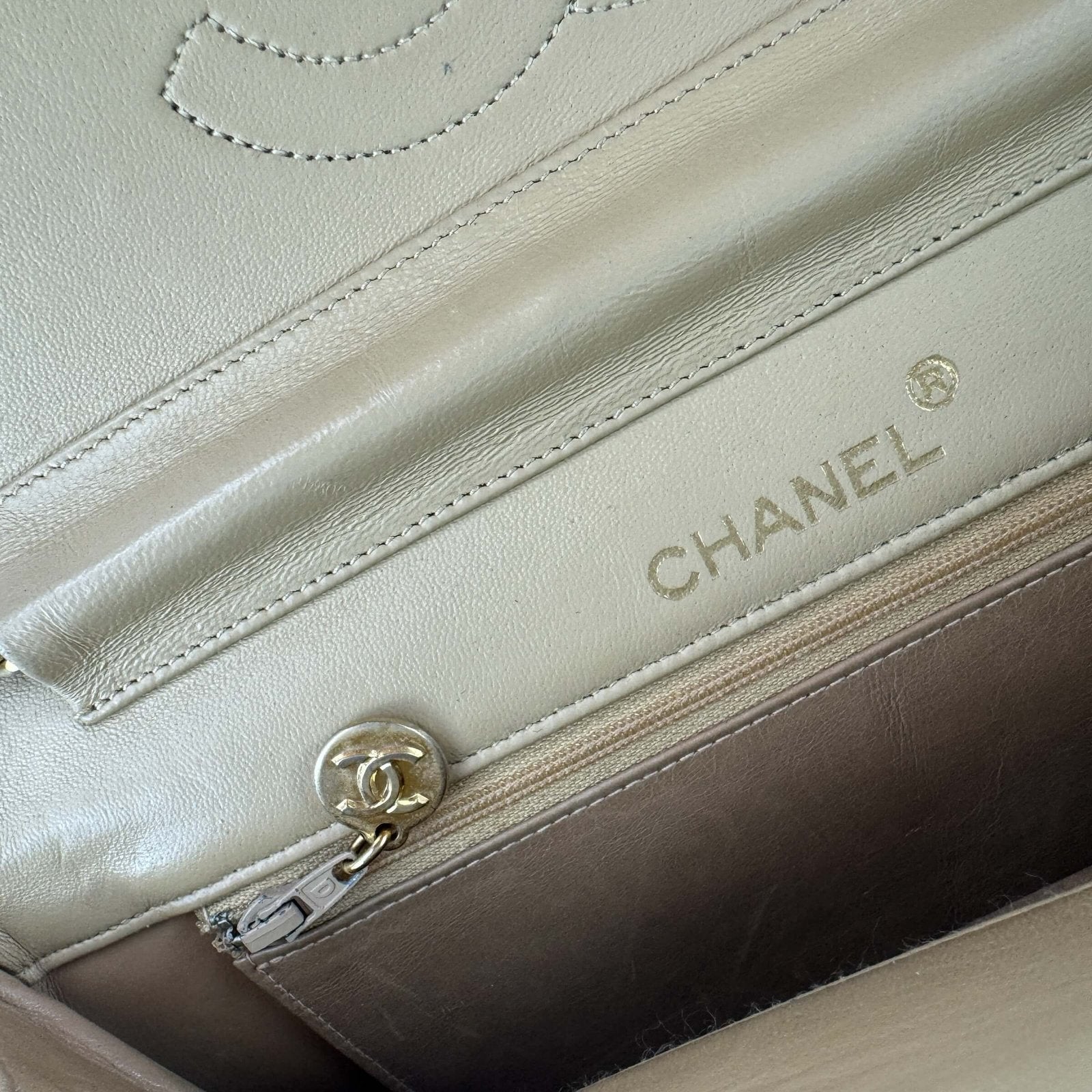 Authentic pre-owned Chanel handbag with a double flap half moon model