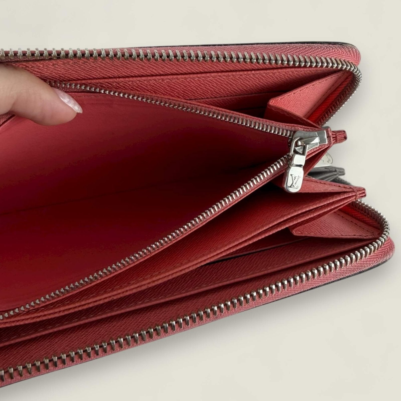 Inside authentic Louis Vuitton Epi leather wallet