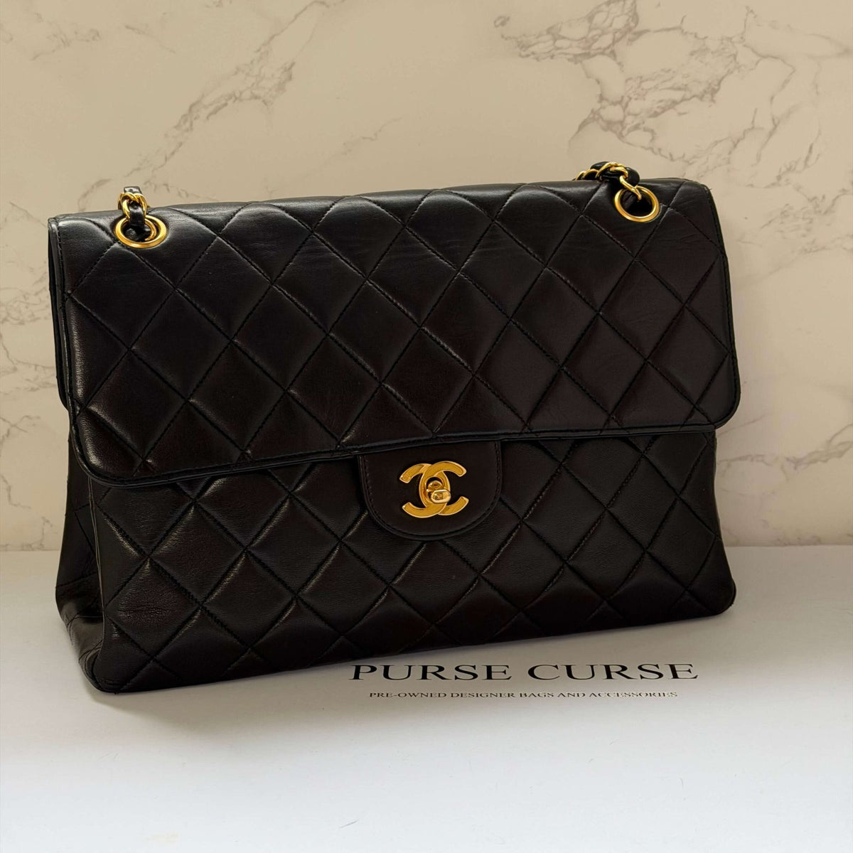 Chanel jumbo flap bag gold chain black lambskin