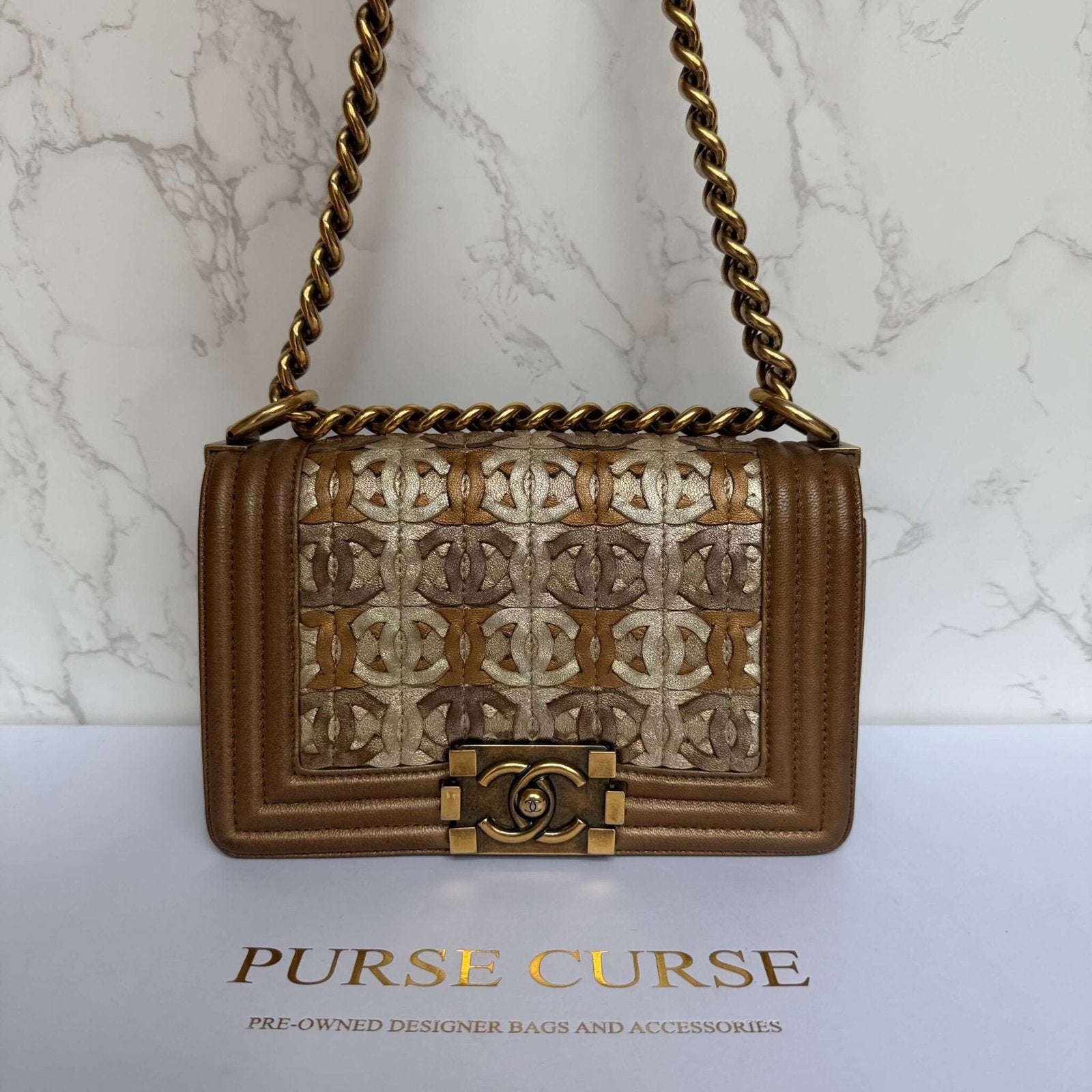 Chanel pre-owned 2014–2015 Small Quilted Metallic Lambskin Interwoven CC Boy Flap crossbody bag