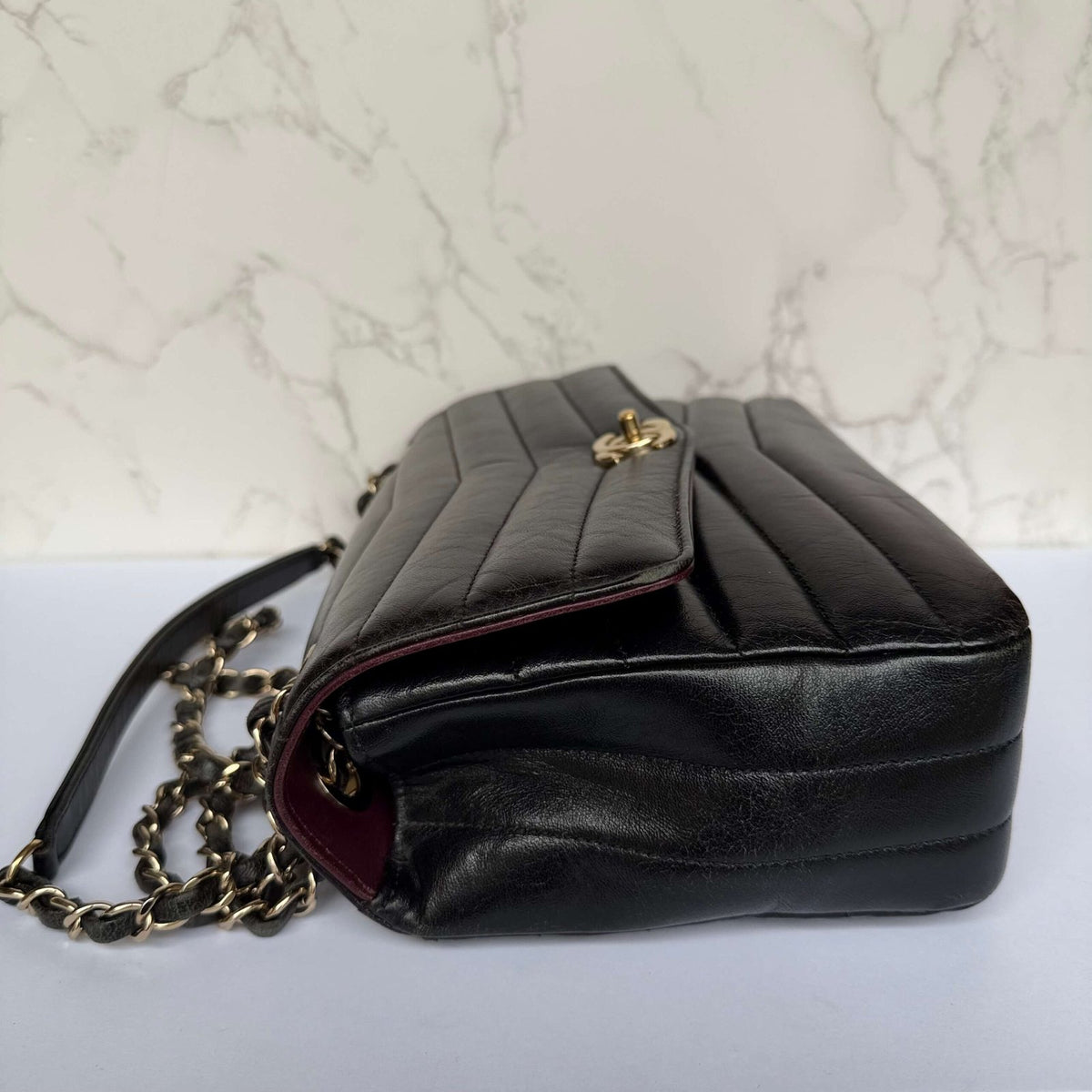 Chanel reversed chevron flap bag side view