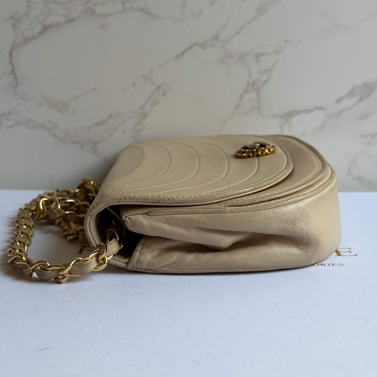 Chanel vintage half moon flap in beige lambskin