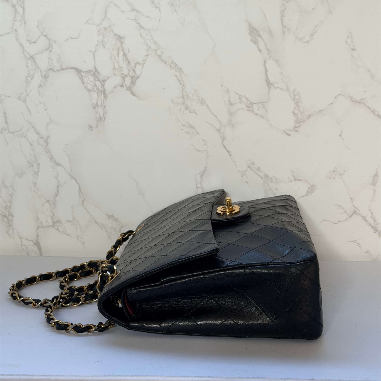 Side view of a vintage Chanel shoulder bag