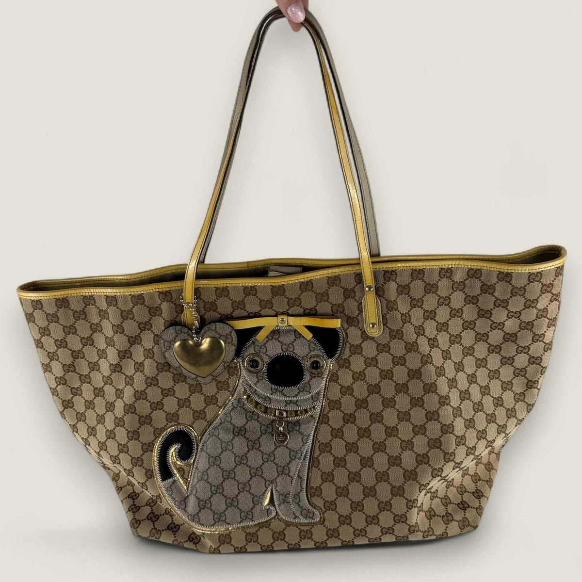 Gucci gg supreme canvas tote with gold details