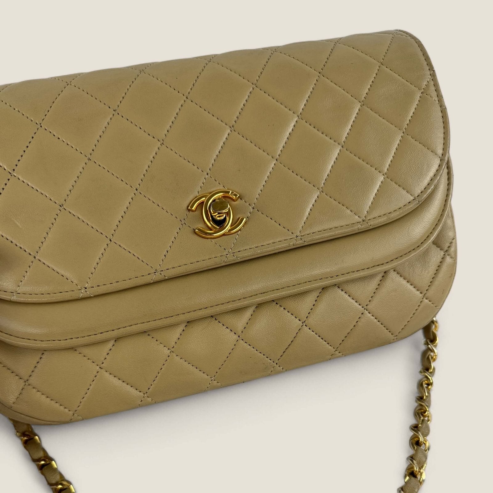 Pre-loved Chanel purse half moon double flap gold hardware vintage