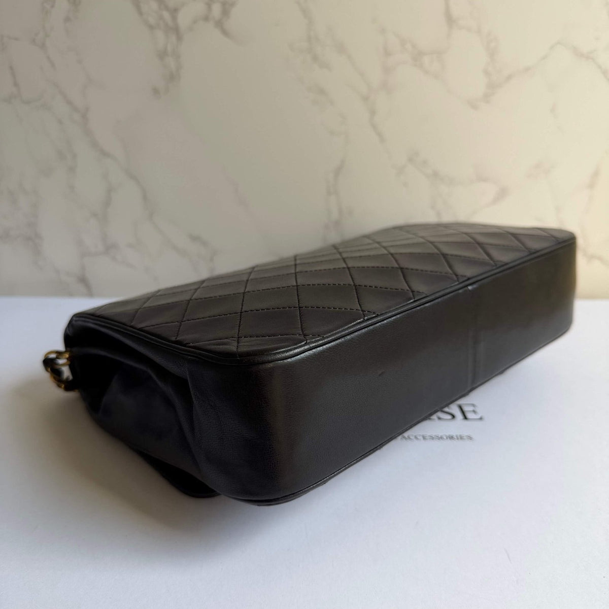 Pre-loved Chanel bag corners signs of use