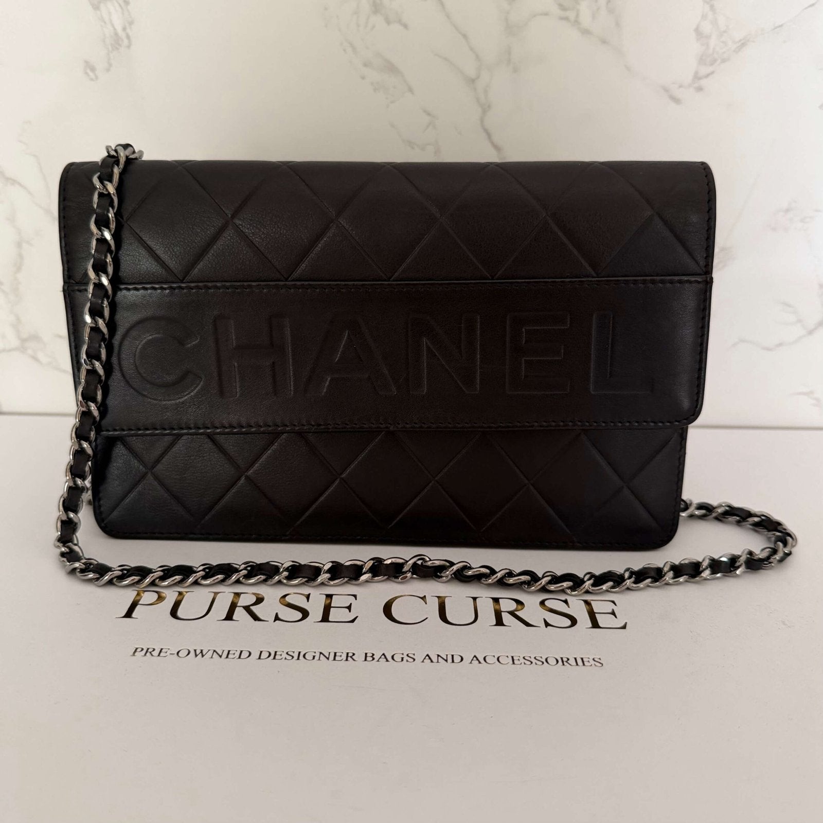 Pre-loved Chanel wallet on chain black leather
