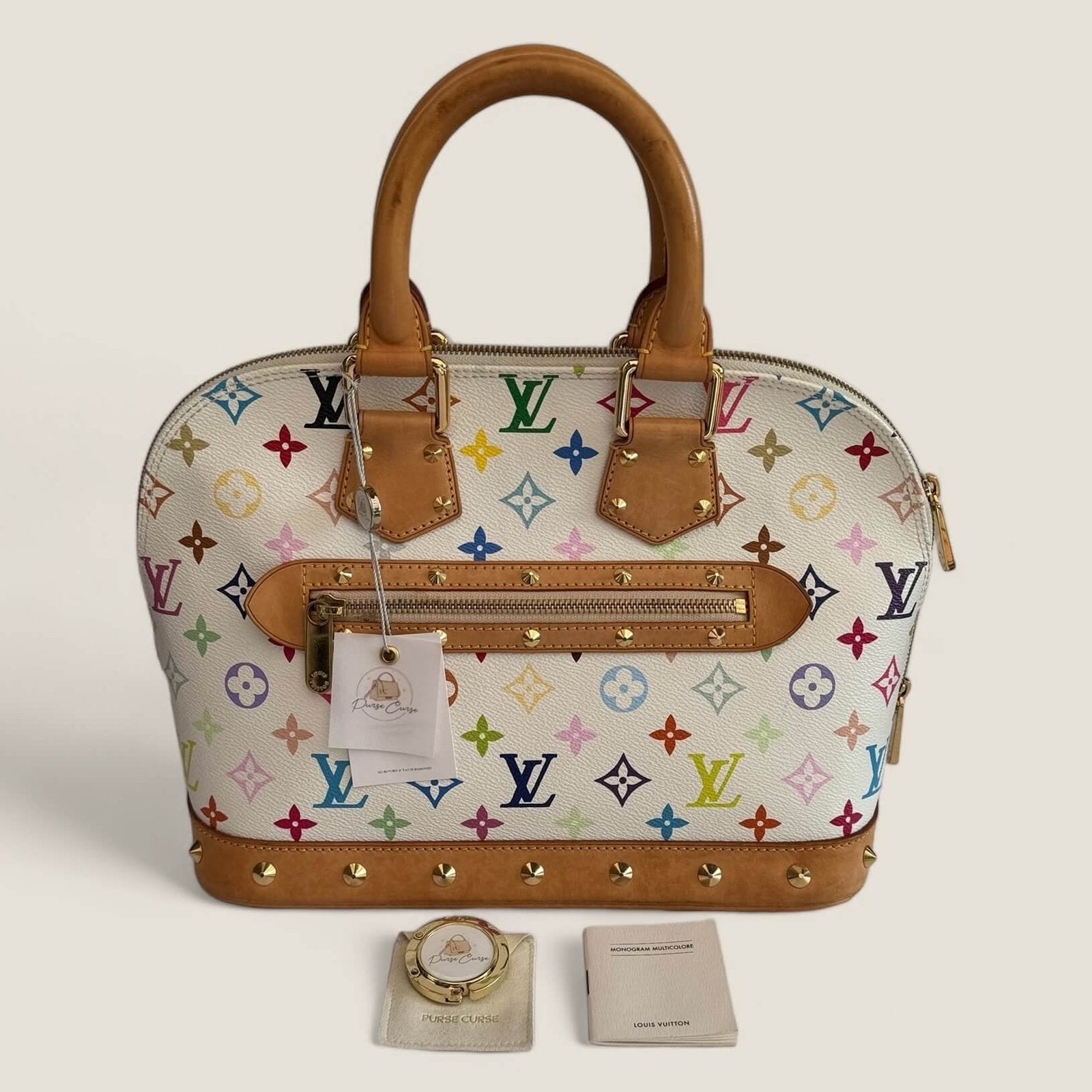 Pre-owned designer bag Louis Vuitton and Purse Curse bag hook