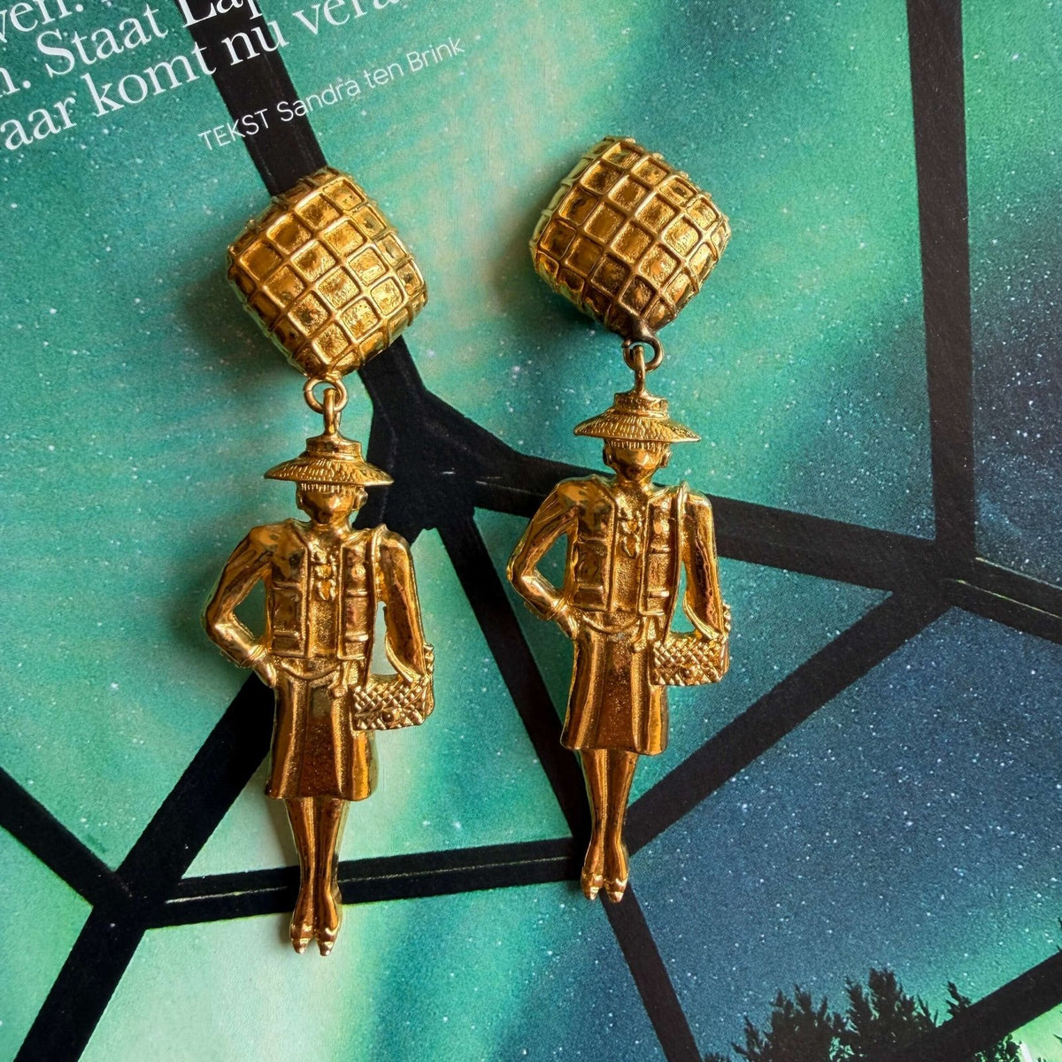 Unique vintage Chanel clip-on earrings featuring Coco Chanel figurines