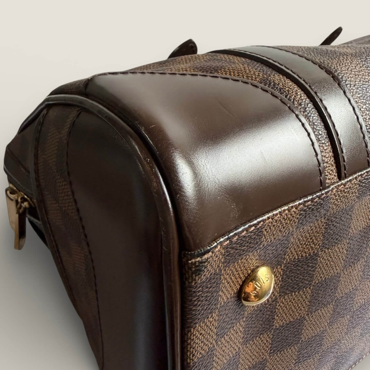 luxury pre-owned Louis Vuitton handbag berkeley model side