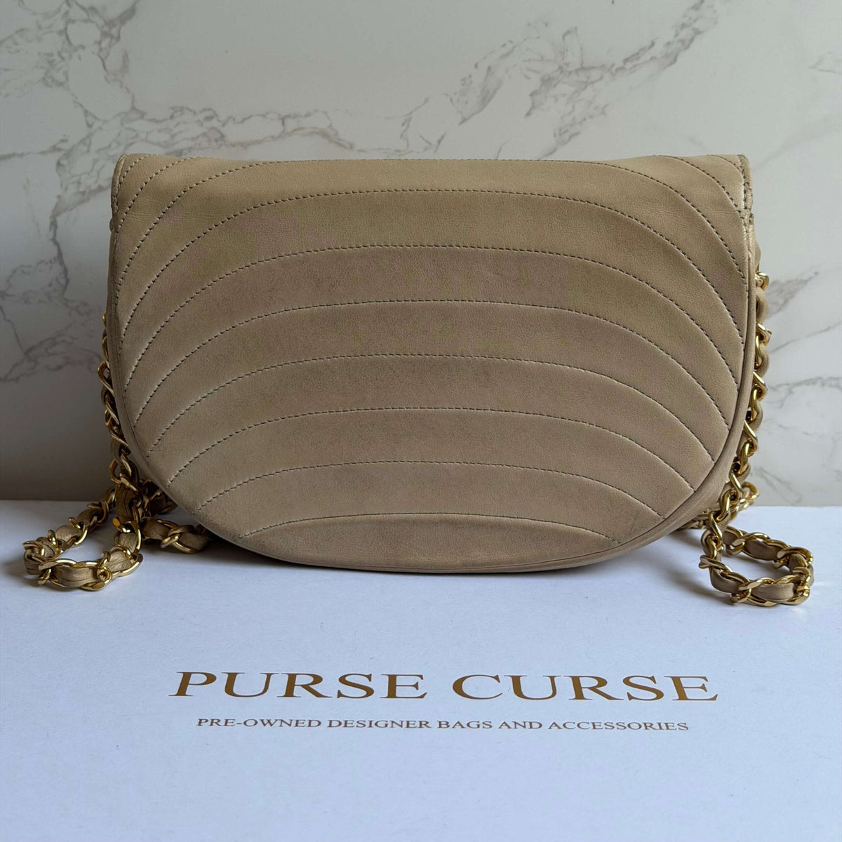 Back of the Chanel half moon single flap<br>