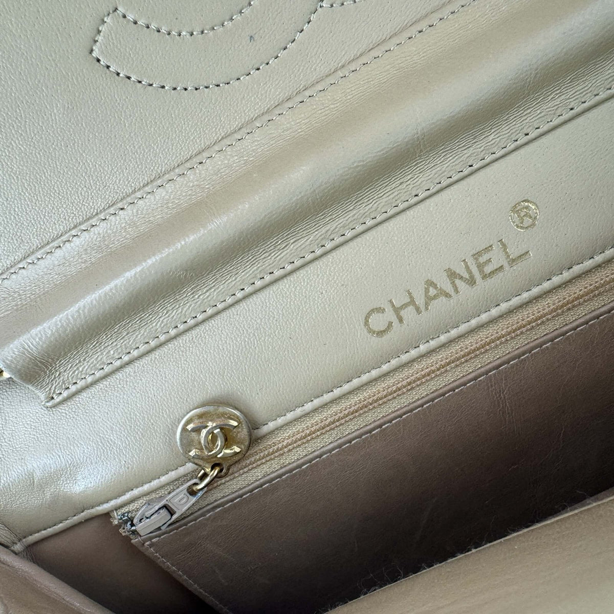 Authentic pre-owned Chanel handbag with a double flap half moon model