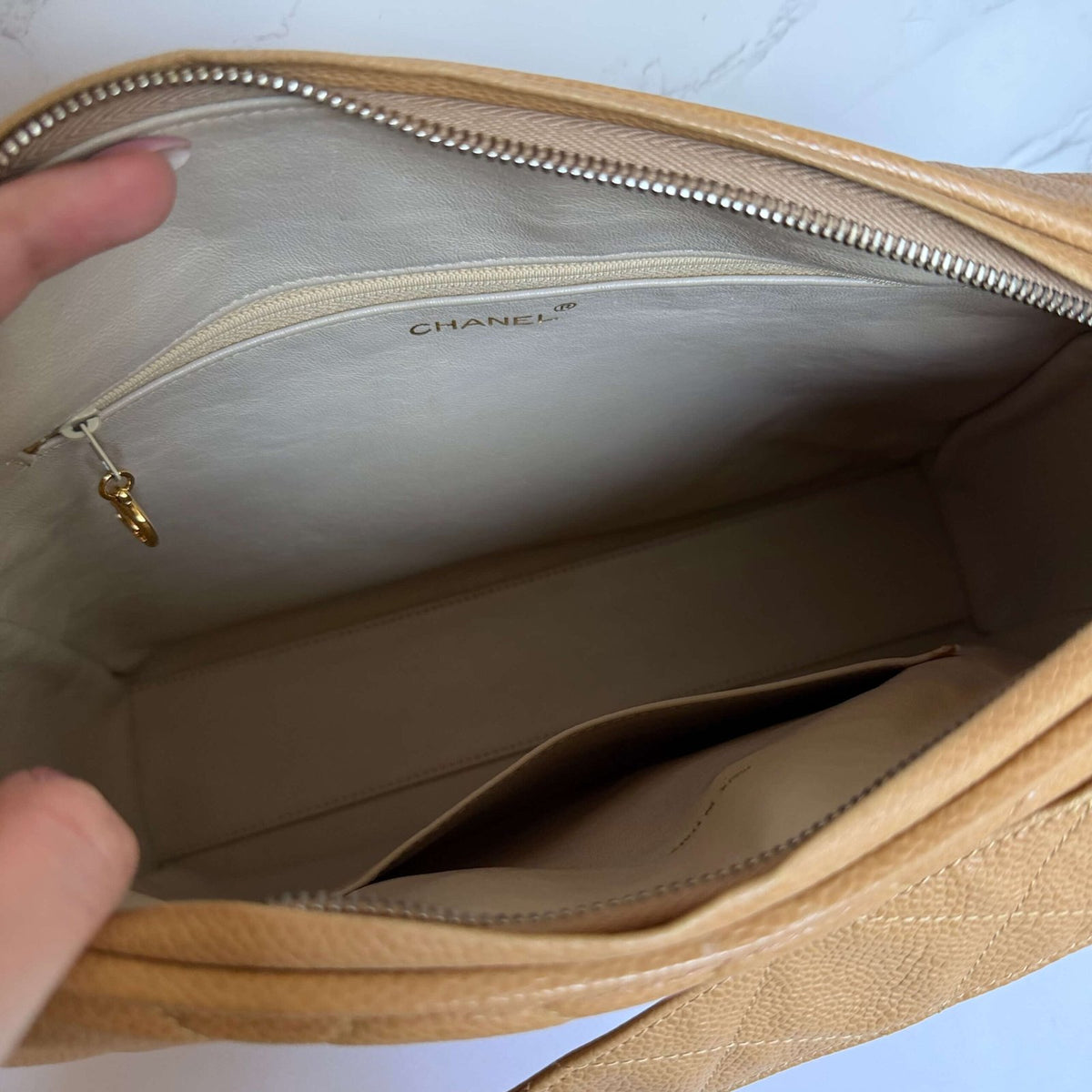 Authentic vintage Chanel beige caviar leather