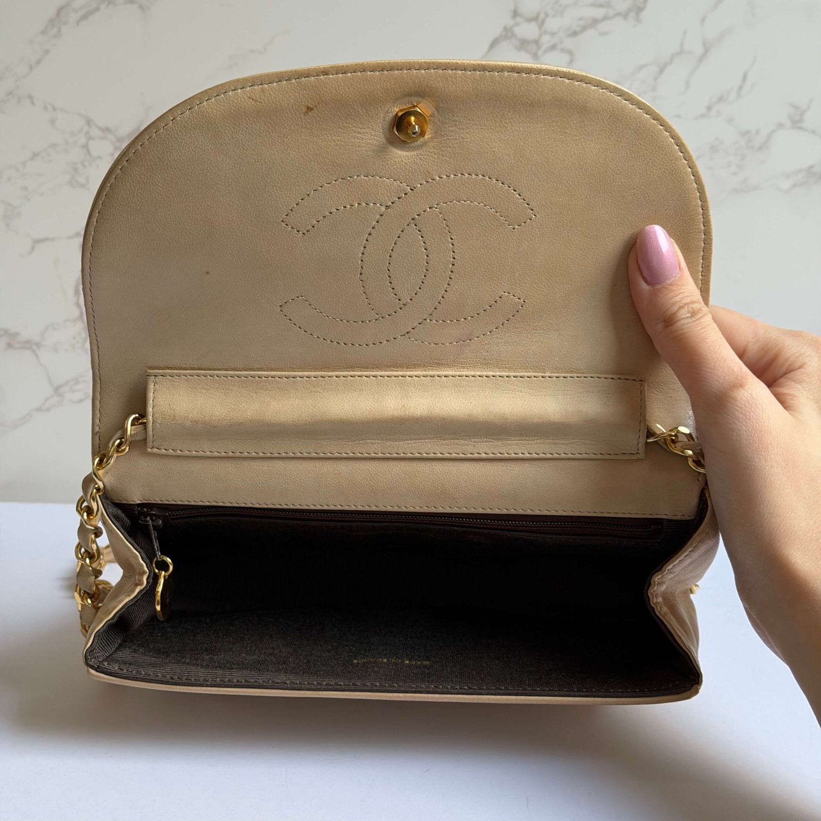 Interior of an authentic Chanel bag in beige<br>