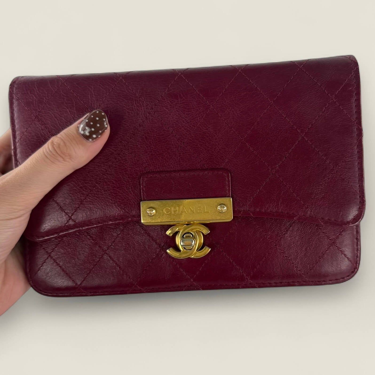 Chanel WOC red elegant worn as a clutch
