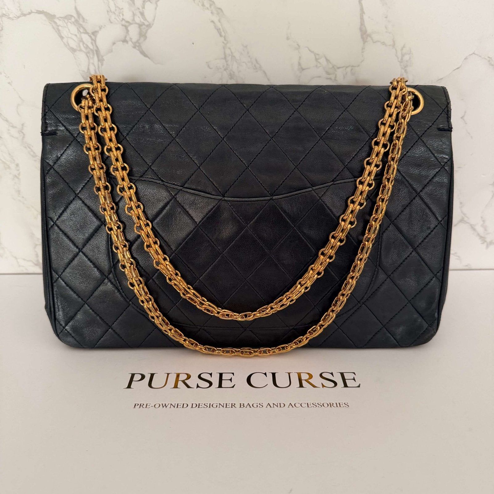 Chanel double flap medium zwart lamsleer achterkant