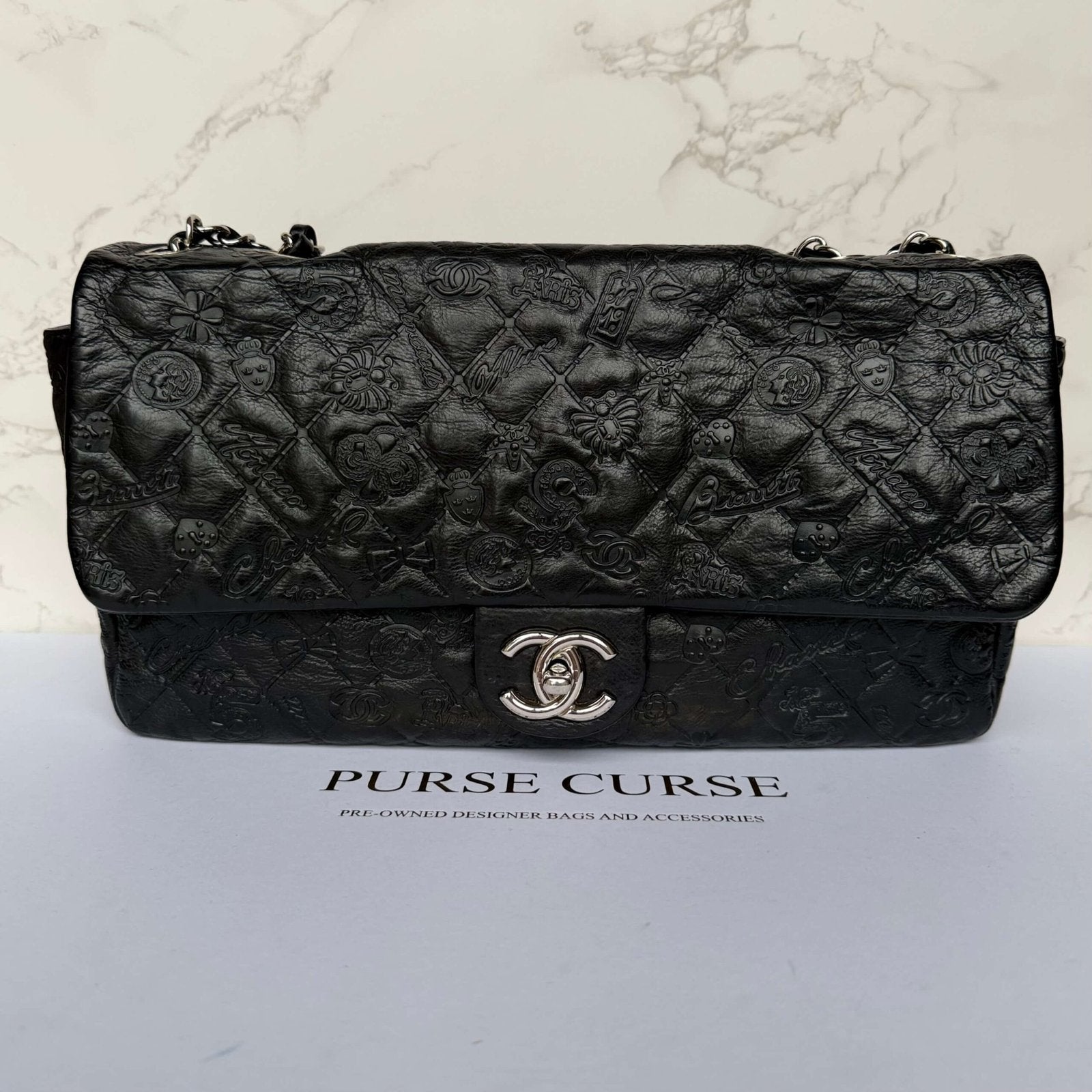 Chanel jumbo lucky symbols embossed calfskin black front view