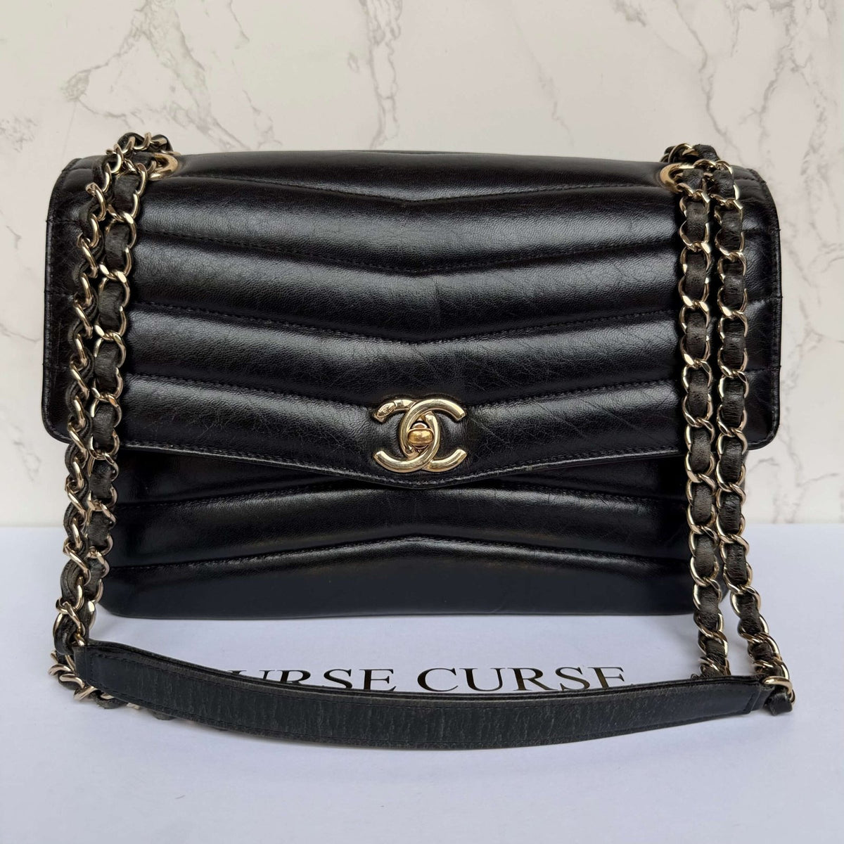 Front view Chanel reversed chevron flap bag