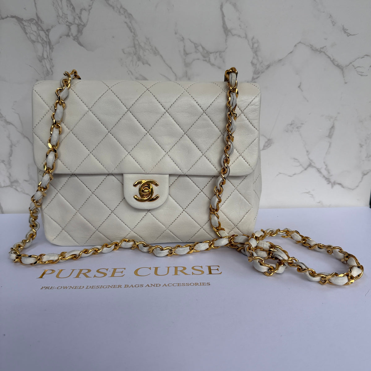 Chanel mini classic flap wit lamsleer 