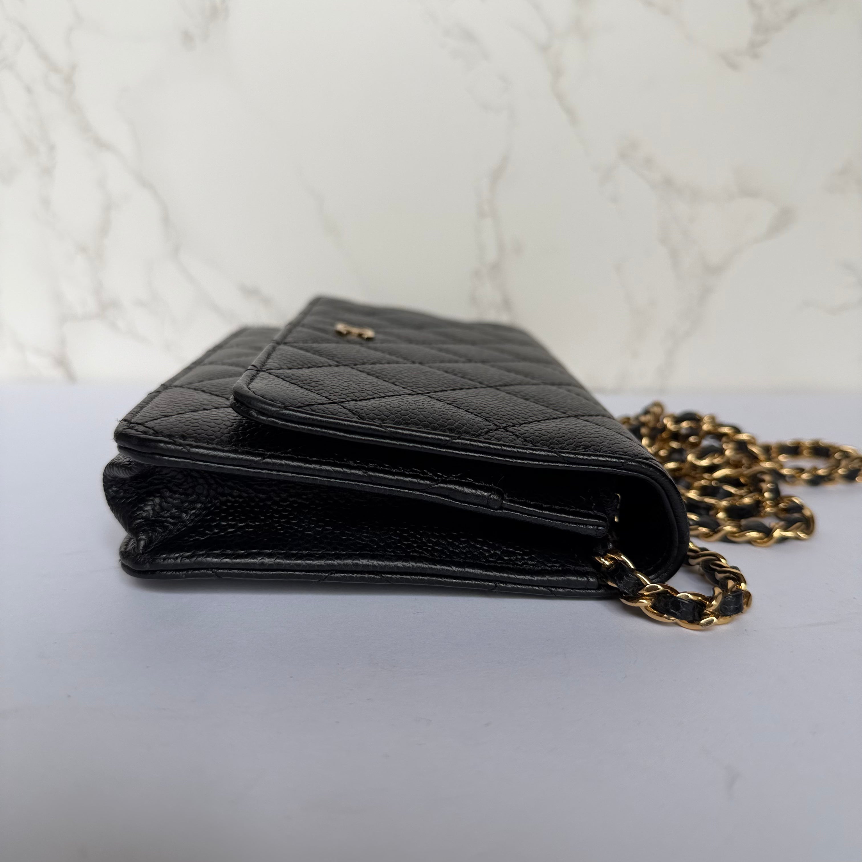Chanel black caviar bag side