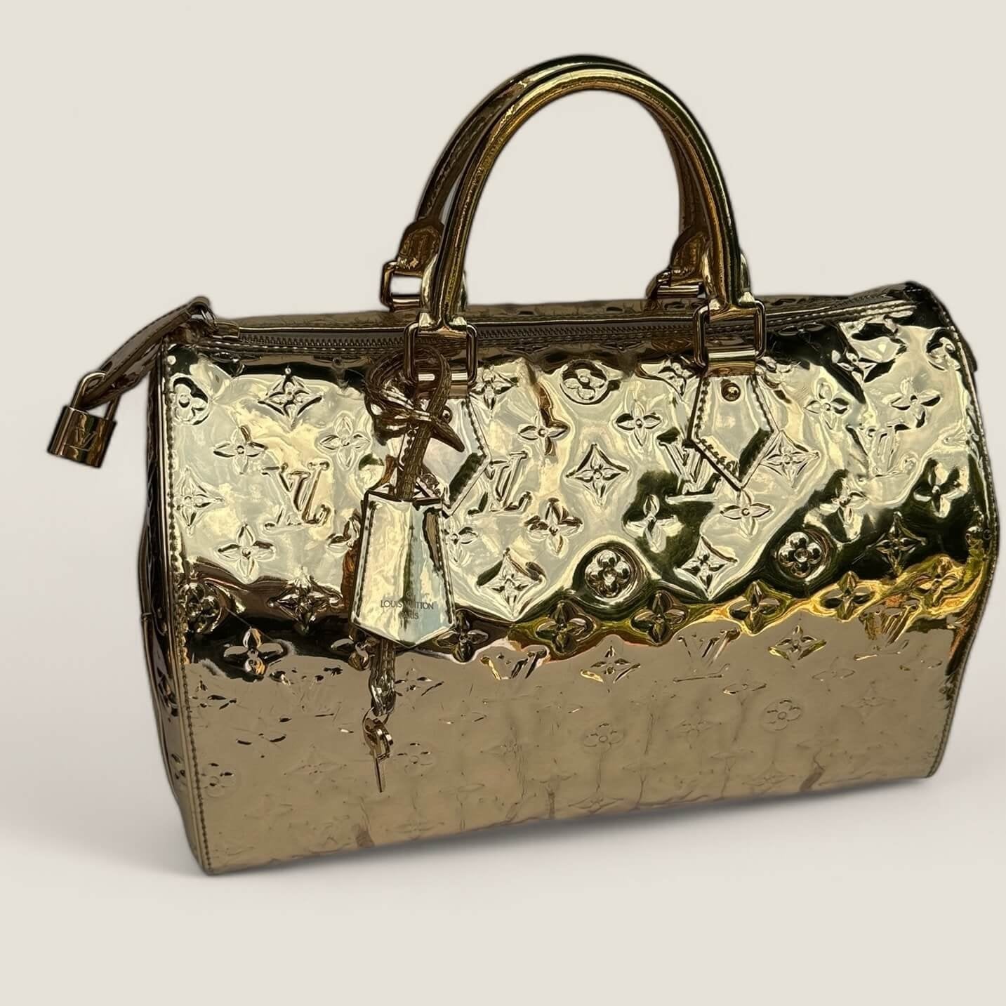 Louis Vuitton pre-owned gold monogram Miroir Speedy 35 gold