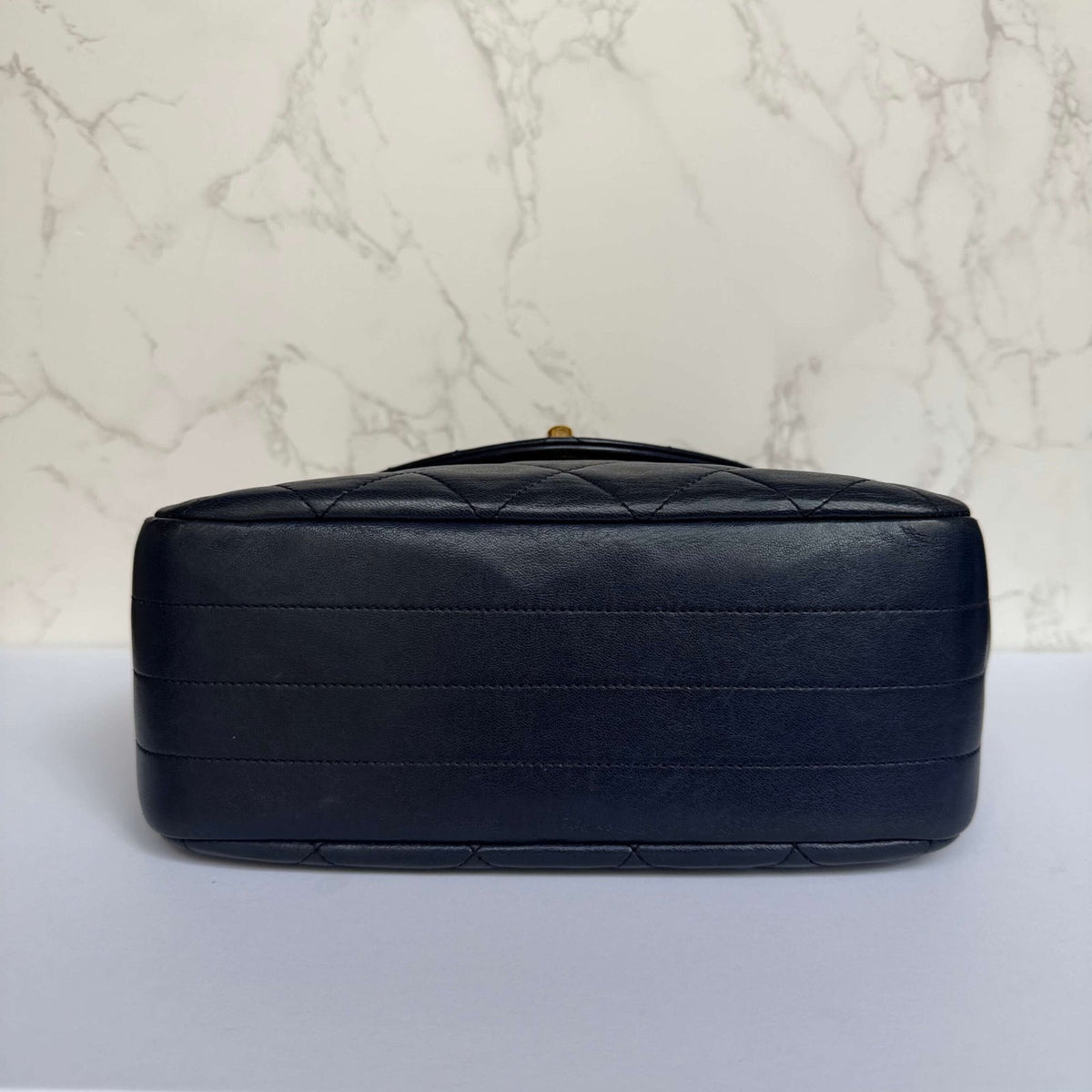 Bottom of authentic Chanel shoulder bag in blue lambskin