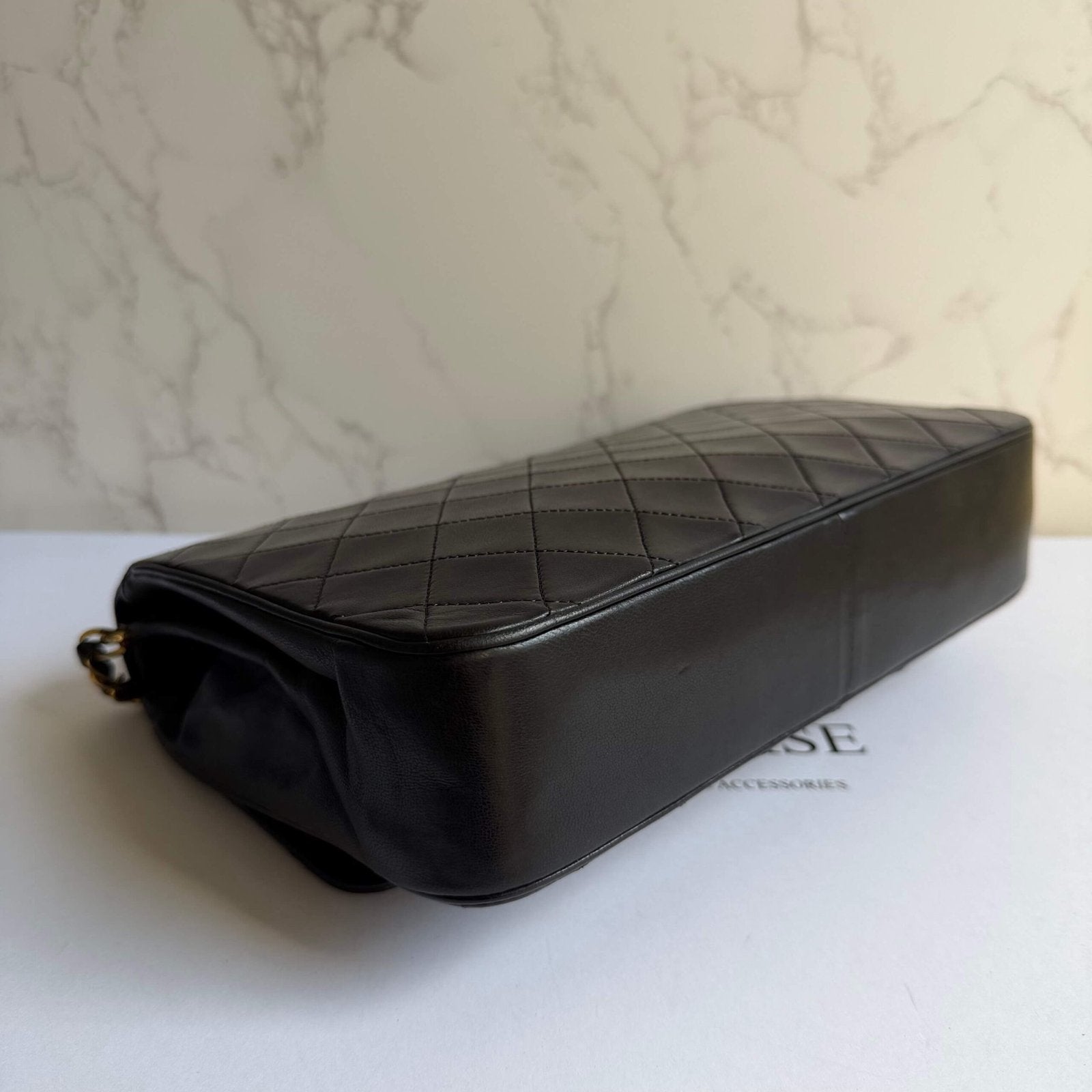 Pre-loved Chanel bag corners signs of use