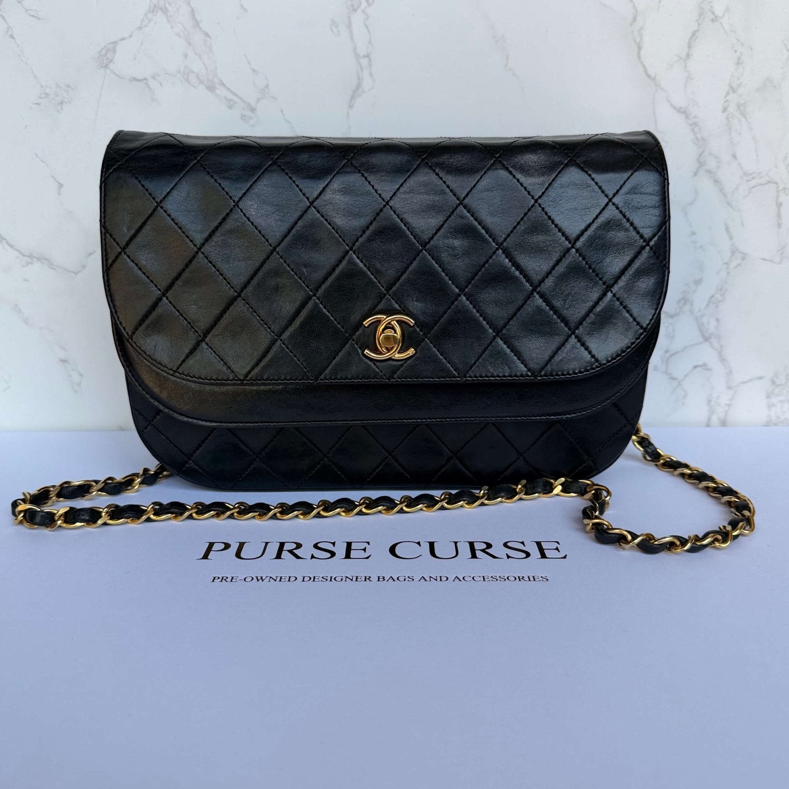 Second-hand Chanel half moon double flap in black lambskin