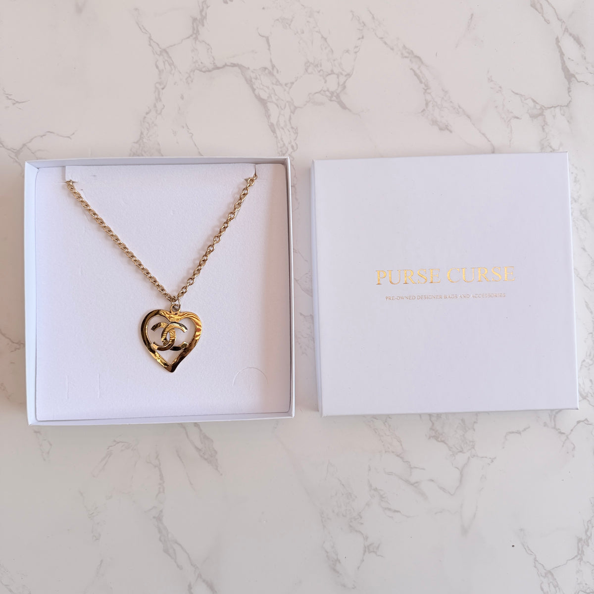 Tweedehands Chanel ketting Purse Curse doosje