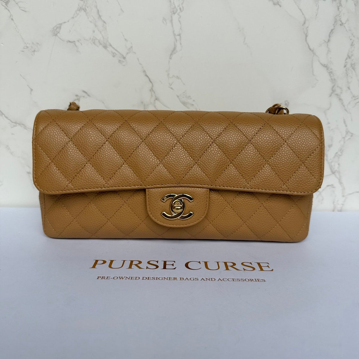 Vintage Chanel East West flap beige caviar