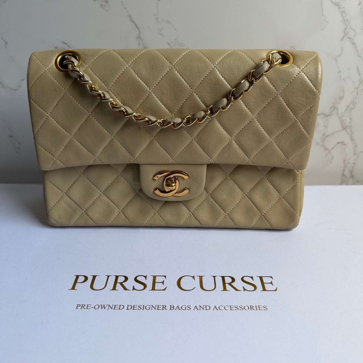 Vintage Chanel small classic flap beige lambskin