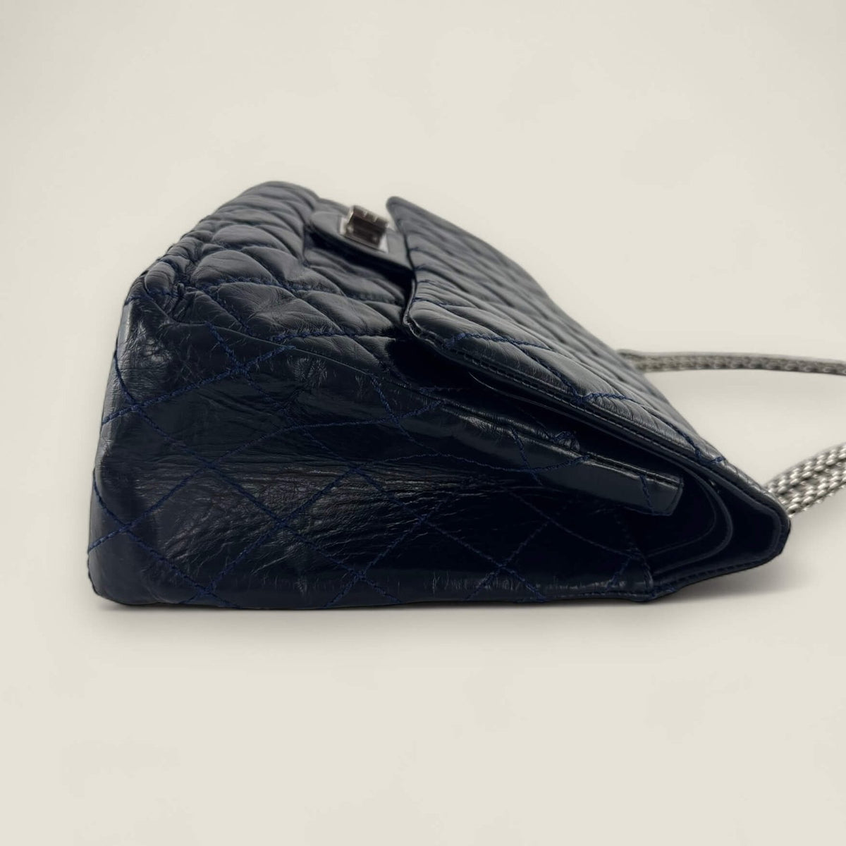 side view Chanel reissue 227 dark blue