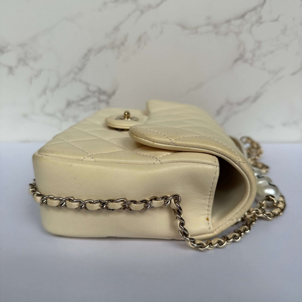 Side of the authentic Chanel my precious pearl chain flap