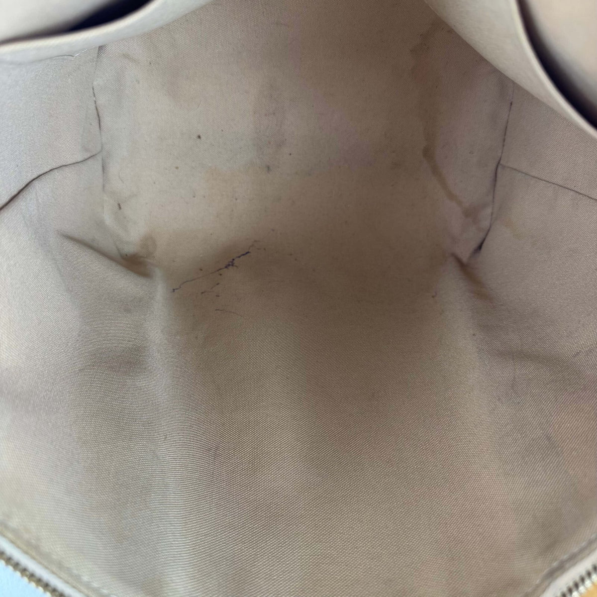 Inside vintage Louis Vuitton bag